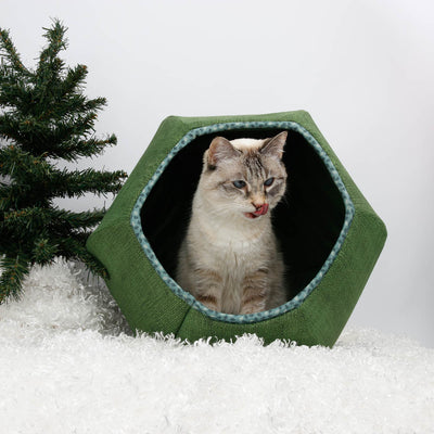 This Cat Ball® cat bed is made with a green fabric printed to look like burlap, and the seams are finished with a contrast binding. Our original hexagonal modern cat bed design is a flexible cave with two openings, made with fabric-covered foam panels, and fits cats to about 18 pounds.