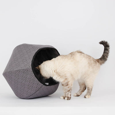 Looking for a cave-style kitty bed with a bold geometric look? Our hexagonal  Cat Ball® cat bed has two openings and is made with cotton fabrics over flexible foam panels. We have used two grey and black geometric prints to create this bold cat pod. Our innovative design fits cats to about 18 pounds and made in the USA