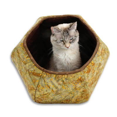 We've used a batik with warm browns, yellows, and greens to create this Cat Ball® cat bed. The lining is a dark brown quilting blender. These fabrics are 100% cotton. Our original hexagonal modern cat bed design is like a cave with two openings. 
