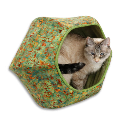 This Cat Ball® cat bed is made in a green and brown cotton batik fabric. The lining is a lighter green cotton, printed to look like burlap. Our original hexagonal modern cat bed design is like a cave with two openings. Made in the USA and ready to ship. 