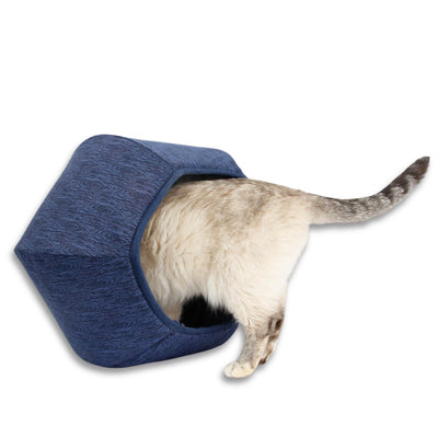 This Cat Ball® cat bed is made with tone-on-tone navy blue fabric cleverly printed to look like wood grain and lined with the same 100% cotton fau bois fabric. Our original hexagonal modern cat bed design is a cave with two openings. Made in the USA and ready to ship. 