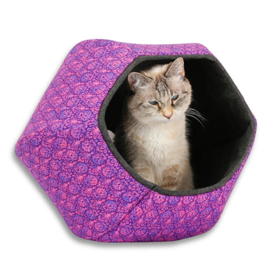 This Cat Ball® cat bed offers a bold look in purple and black! Made with all cotton fabrics over six flexible foam panels, and finished with bias-cut trim. Our original hexagonal modern cat bed design is like a cave with two openings and fits cats to about 18 pounds