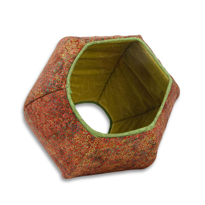 This Cat Ball® cat bed is made with an oxblood red-tone batik and finished with a green contrast bias trim. These fabrics are 100% cotton. Our original hexagonal modern cat bed design is like a cave with two openings. Made in the USA and ready to ship. 