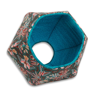 This Cat Ball® cat bed is made with a fantasy bird fabric in shades of brown and green, and accented in coral, turquoise, and white. Lined in a coordinating turquoise print. All cotton over flexible foam panels. Our original hexagonal modern cat bed design is a cave with two openings. Made in the USA and ready to ship.