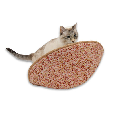 A small cat explores a jumbo-size Cat Canoe® made in a cotton in red and brown earthy, bohemian colors. 