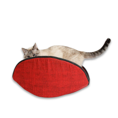 A small cat inside our jumbo-size Cat Canoe® modern pet bed,  made with a red cotton printed to look like woven burlap fabric. This bed is designed to fit large cats. 