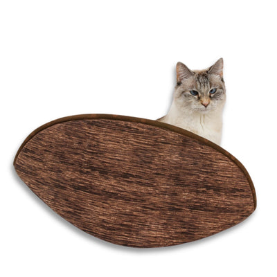 A tiny cat inside our jumbo-size Cat Canoe® modern cat bed. Designed to accommodate 18-pound cats (and larger) the fabric-covered foam panels will press out, then bounce back in to hold your cat closely, helping to retain heat. Made in USA.